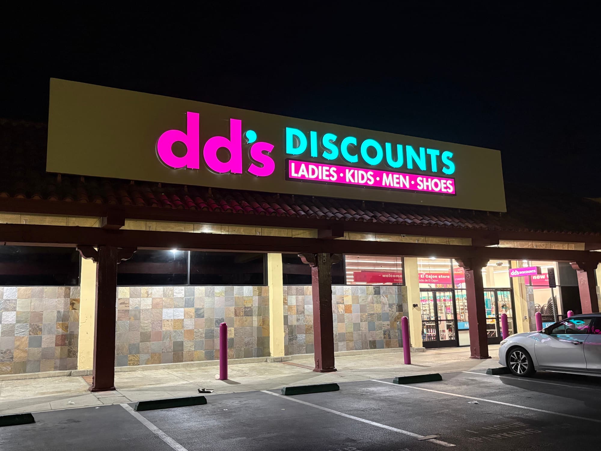 dd's DISCOUNTS — retail build-out, El Cajon dd's DISCOUNTS store in El Cajon, CA (San Diego) lit up at night — retail electrical tenant improvement, service, panelboards and illuminated storefront sign by Astral Electrical Contractor, C-10 #1114918.